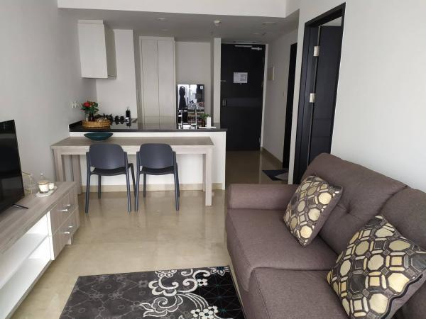 Kitchen equipped with microwave and fridge